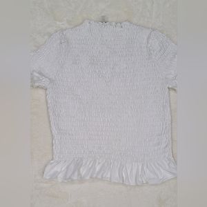 Women "T Tahari" smocked peplum top. Size medium